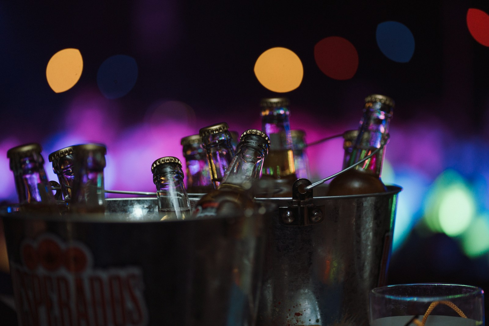 Beer bottles arranged in a metal bucket