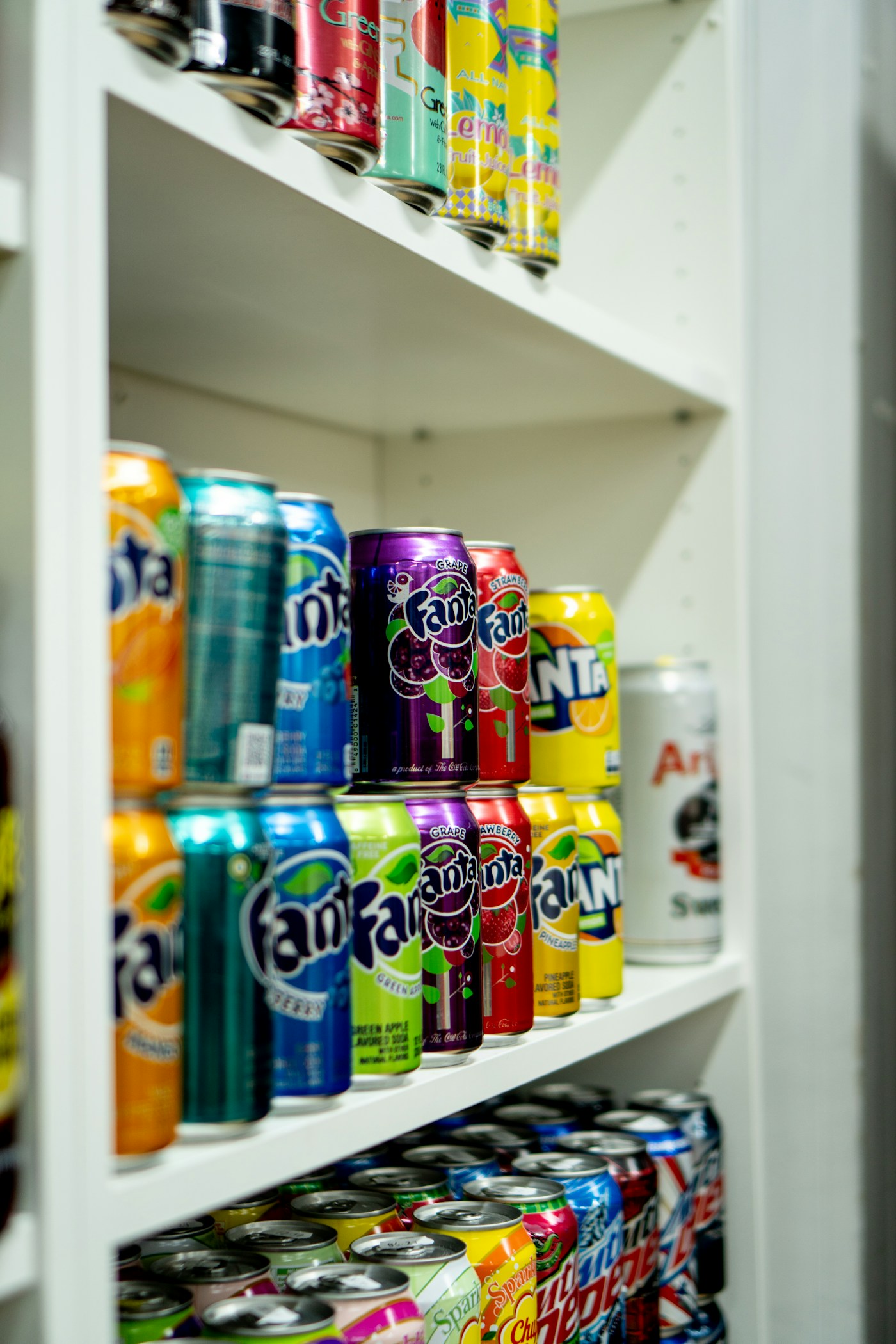 Colourful cans of soft drinks